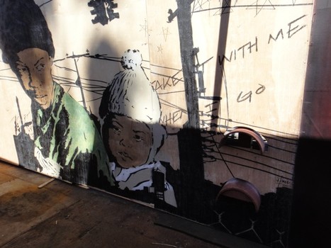 At the entrance to the Fountain Fair: shadows are cast on a mural by Brooklyn artist Chris Stain.
